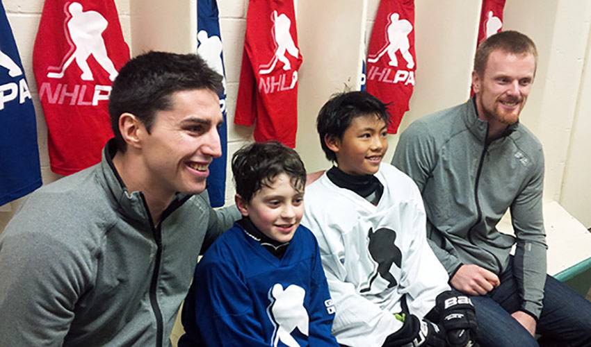 devin smith and markus naslund with new equipment