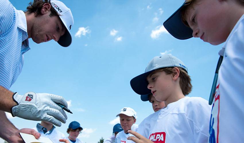 Players Drive The Green At Annual Golf Classic