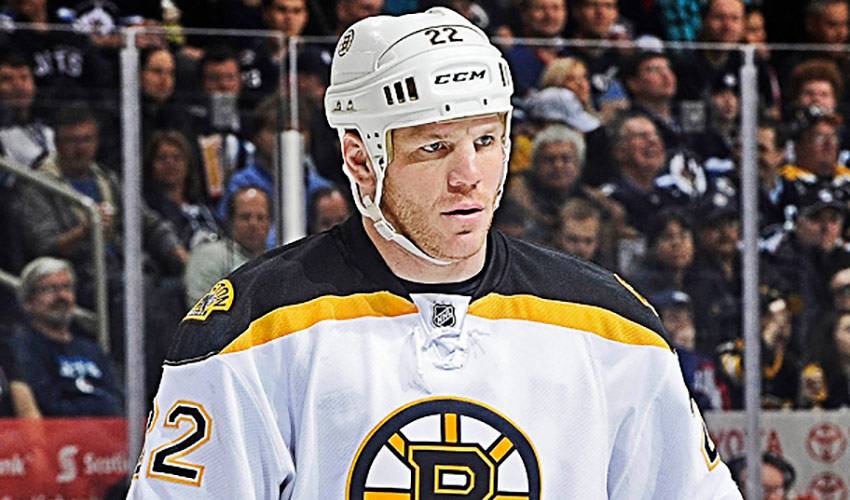 Boston Bruins player Shawn Thornton brings the Stanley Cup to