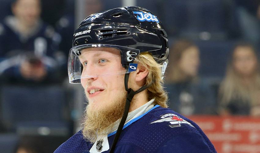 Patrik Laine giving an assist to mental health resources