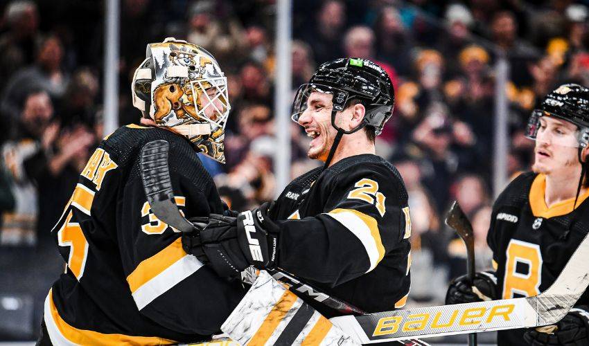 Brad Marchand of the Boston Bruins wears a Hockey Fights Cancer warm  News Photo - Getty Images