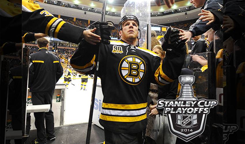 Boston Bruins player Shawn Thornton brings the Stanley Cup to