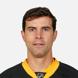 Headshot image of Tom Kostopoulos